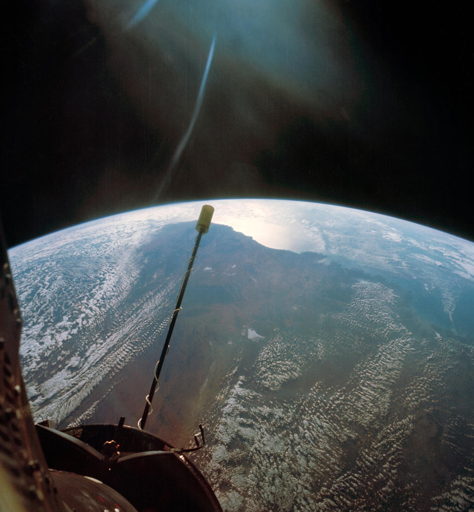 the curve of earth against the blackness of space, seen from an orbiting spacecraft