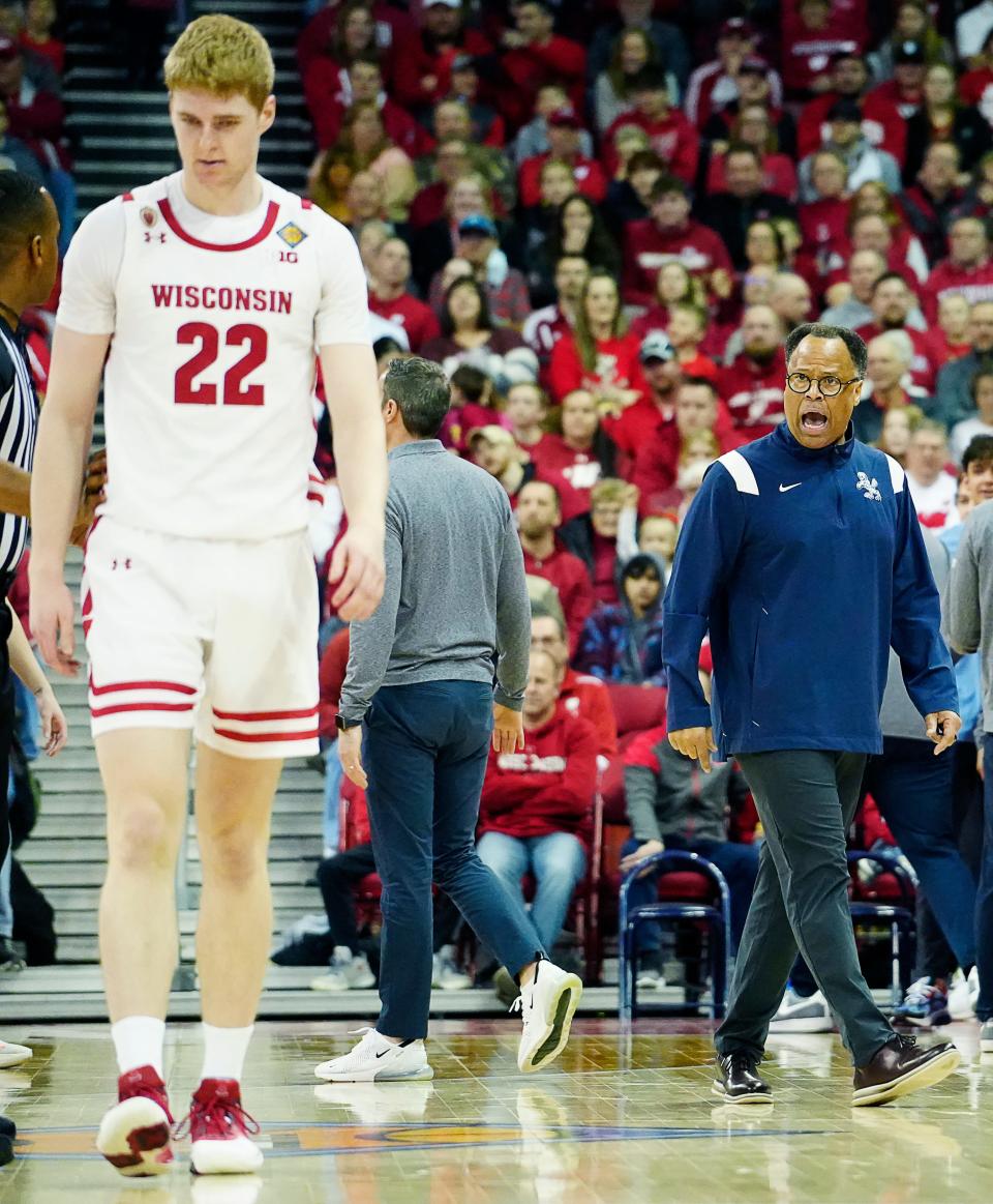 Liberty coach Ritchie McKay yells toward Wisconsin forward Steven Crowl, who was assessed a Flagrant 1 and a technical with 49.5 seconds left in the first half Sunday.