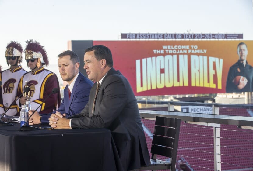 LOS ANGELES, CA - November 29 2021: New USC head football coach Lincoln Riley, left, and USC Athletic Director.