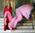 <p>Ellie Goulding strikes a pose in a red and pink ensemble ahead of her performance at The Victoria and Albert Museum in London on Wednesday, which was live-streamed to fans online. </p>