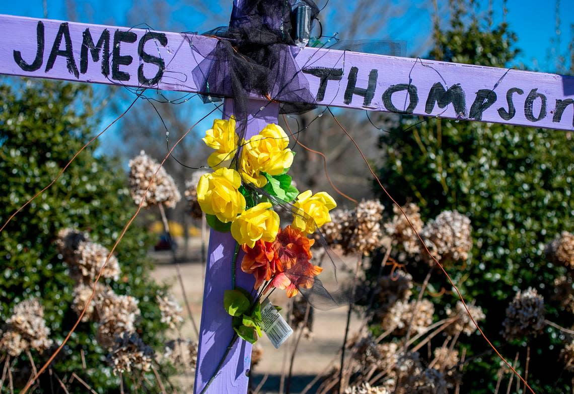 A cross memorializes James Thompson, a victim of the mass shooting, at the entrance to the Hedingham neighborhood on Friday, January 13, 2023 in Raleigh, N.C.
