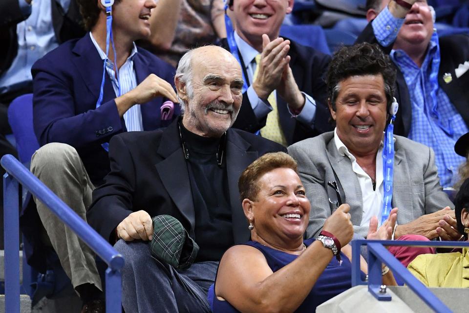 The retired actor took in some tennis on Tuesday.