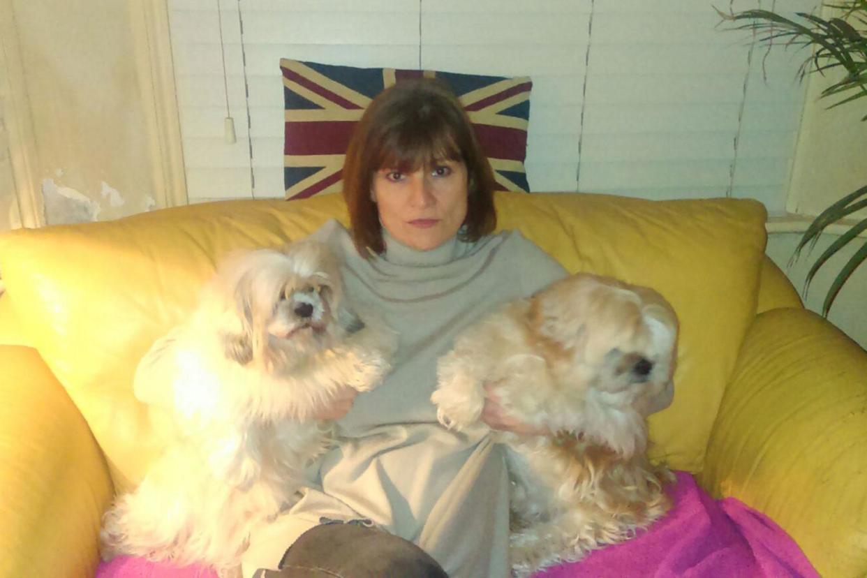 Companions: Ashleigh Costello, who is deaf, with the Shih Tzus. Her housing association said the dogs constituted a nuisance