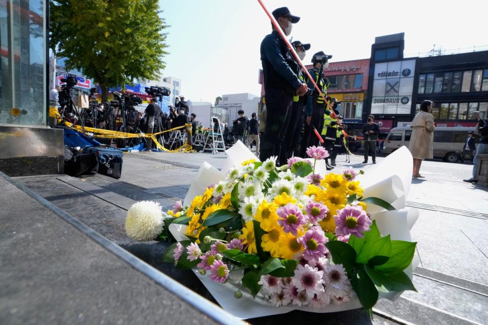 Flowers are seen near the scene of a deadly accident in Seoul (AP)