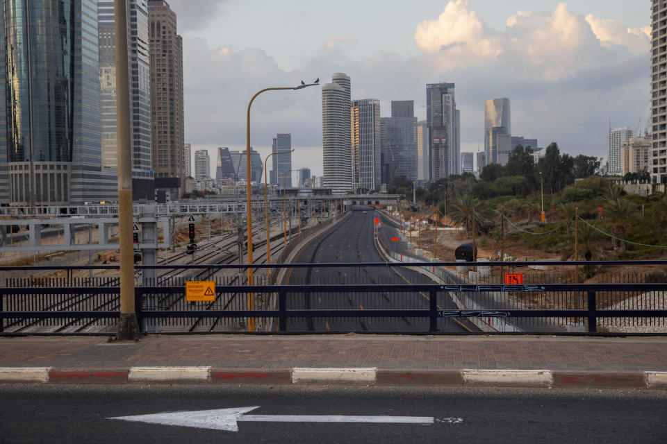 A highway is empty from cars following new restrictions in the three-week nationwide lockdown, in Tel Aviv, Israel, Saturday, Sept. 26, 2020. (AP Photo/Oded Balilty)