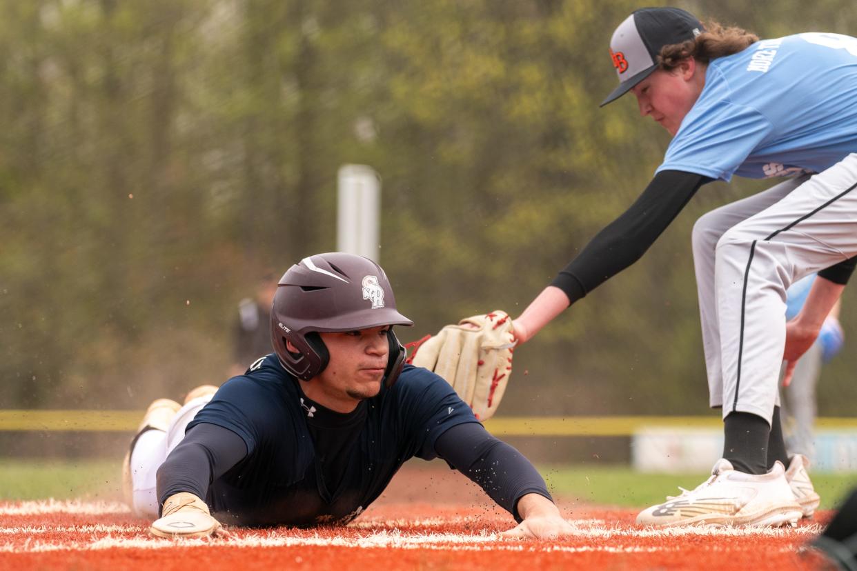 South River's Julius Rosado (25) slides into home against East Brunswick Magnet's Charlie Misura (8) on Friday, April 19, 2024 afternoon at the field at North Brunswick Community Park in North Brunswick.