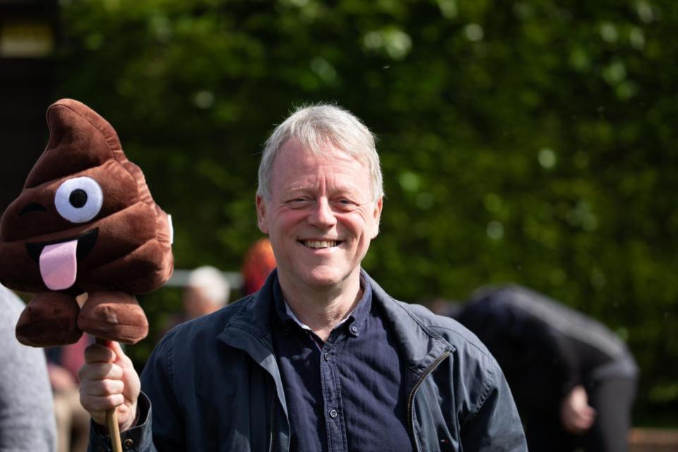 Reading Chronicle: An activist holds an emoji poo cuddly toy at the protest against raw sewage pollution of rivers in Newbury on Sunday, April 14. Credit: John Sutton, Clearwater Photography