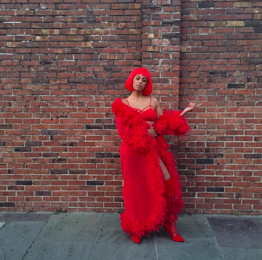 Solange poses in all-red everything in New Orleans on Feb. 8, 2016