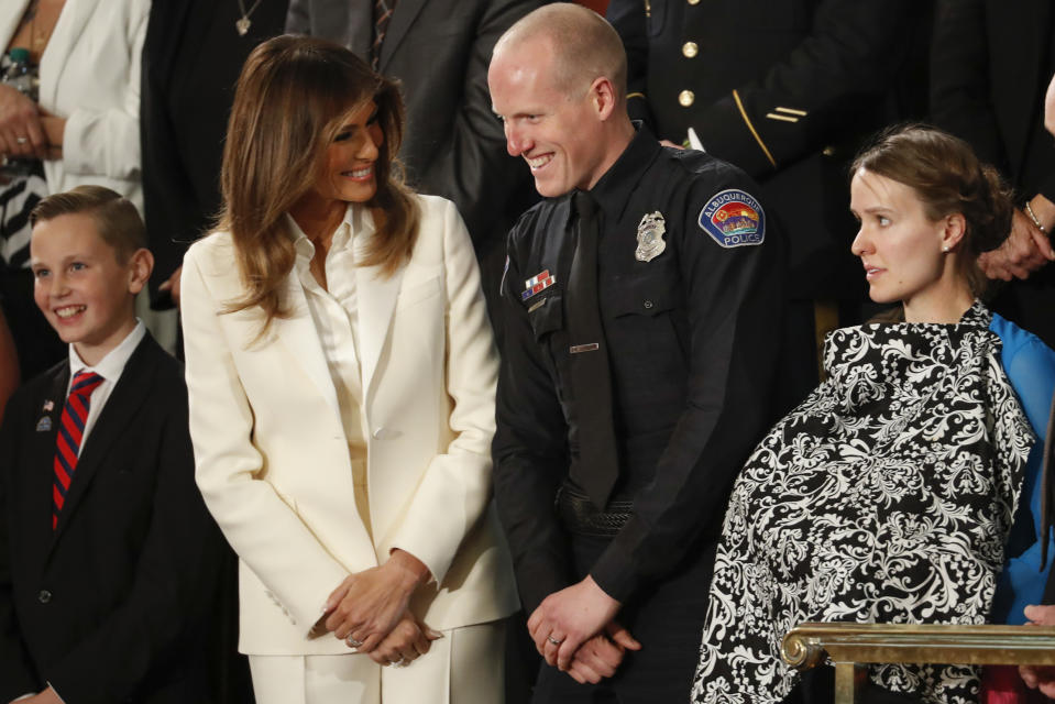 <p>First lady Melania Trump talks with Albuquerque police officer Ryan Holets and his wife before the State of the Union address to a joint session of Congress on Capitol Hill in Washington, D.C., on Jan. 30. (Photo: Pablo Martinez Monsivais/AP) </p>