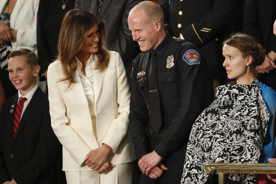 The first lady speaks with guests