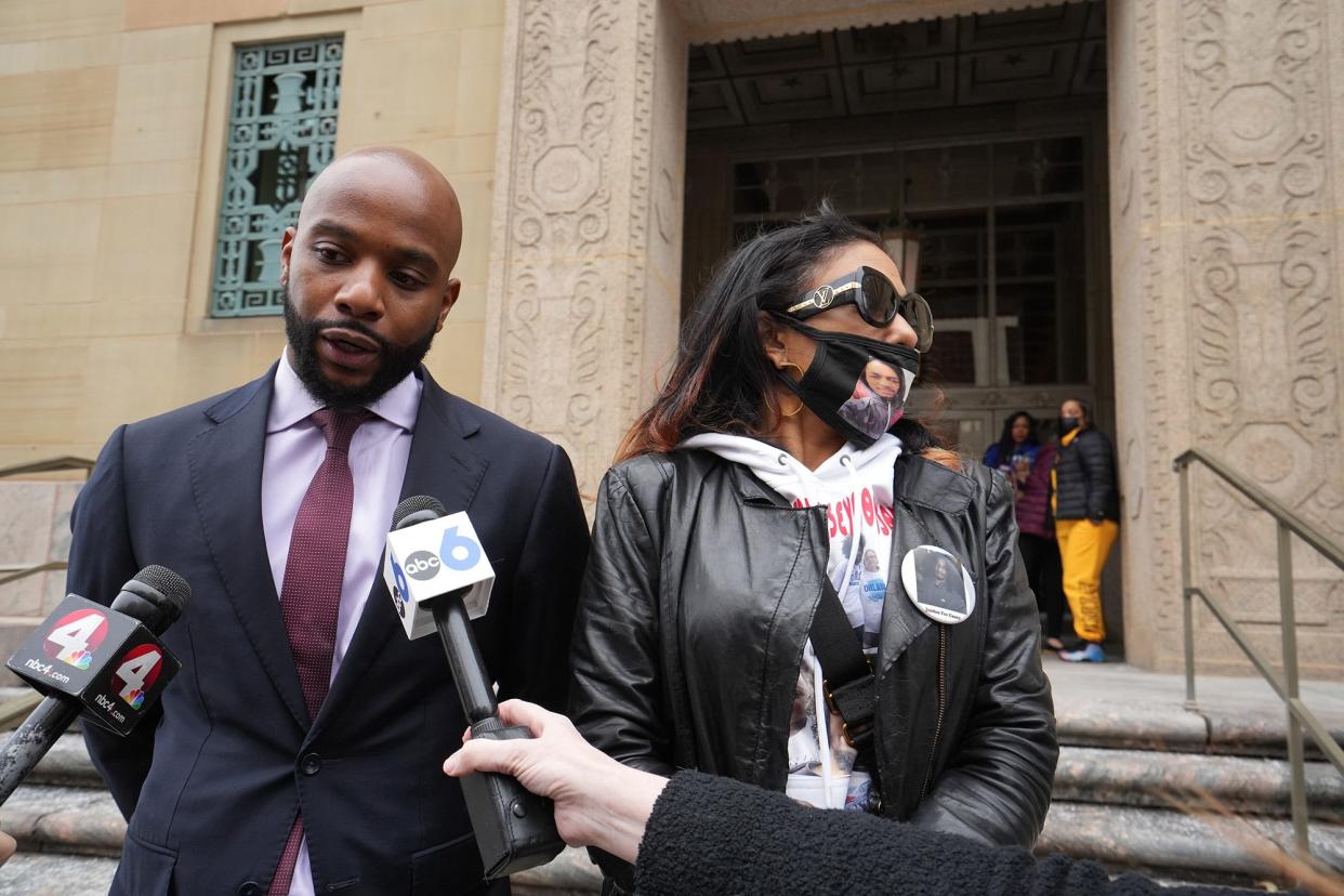 Attorney Sean Walton, left, and Casey Goodson Jr.'s mom, Tamala Payne, right, meet with the press outside of the federal courthouse in Columbus.