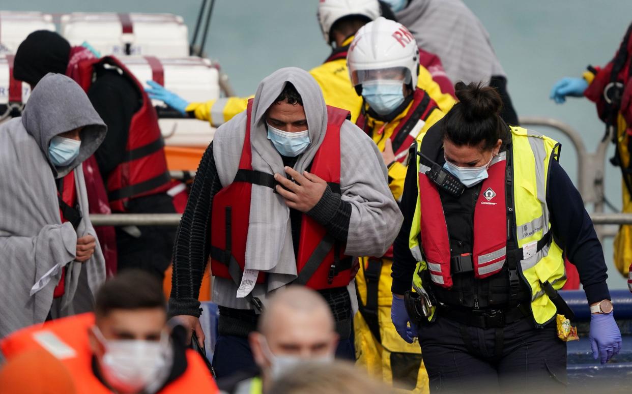 People thought to be migrants are brought into Dover, Kent, by Border Force officials on Monday - Gareth Fuller/PA Wire