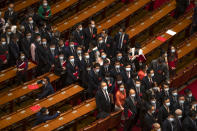 Delegates wait to leave after the closing session of China's National People's Congress (NPC) at the Great Hall of the People in Beijing, Thursday, May 28, 2020. China's ceremonial legislature has endorsed a national security law for Hong Kong that has strained relations with the United States and Britain. (AP Photo/Mark Schiefelbein)