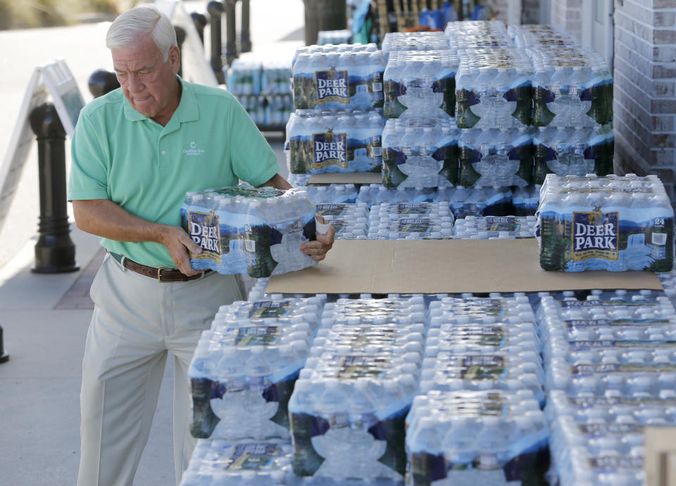 Larry Pierson purchases bottled water from the Harris Teeter grocery store in preparation for Hurricane Florence in Isle of Palms on Monday.