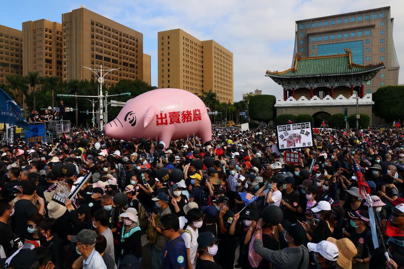 People join a protest to oppose the import of U.S. pork containing ractopamine, an additive that enhances leanness in Taipei