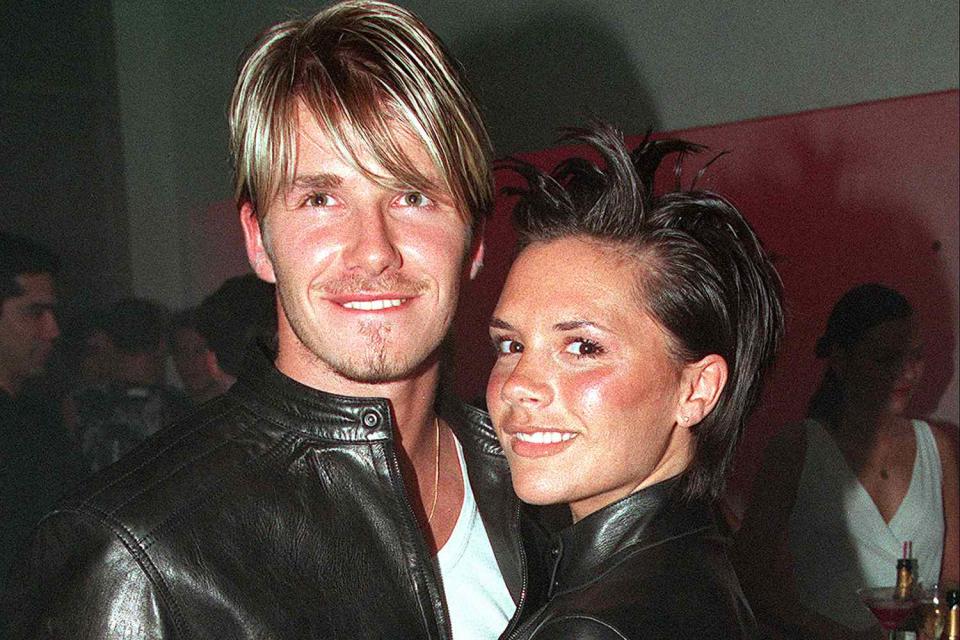 <p>Dave Hogan/Getty</p> David Beckham and Victoria Beckham attend the Versace Store opening party on June 11, 1999, in London
