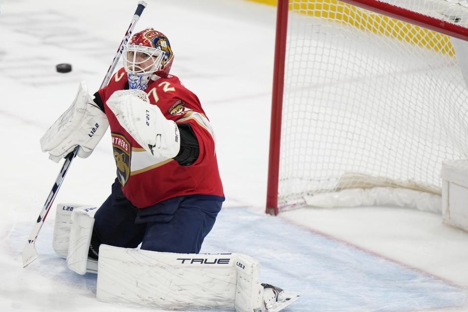 Florida Panthers goaltender Sergei Bobrovsky makes a save during the third period of an NHL hockey game against the Vancouver Canucks, Saturday, Jan. 14, 2023, in Sunrise, Fla. (AP Photo/Wilfredo Lee)