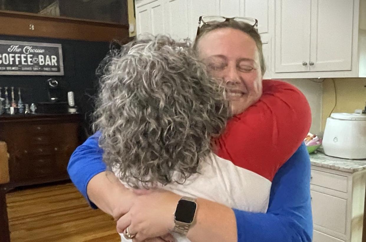 Valerie Mockus, in blue, receives a hug just after learning that Mockus had been elected mayor of Hebron on Nov. 7.