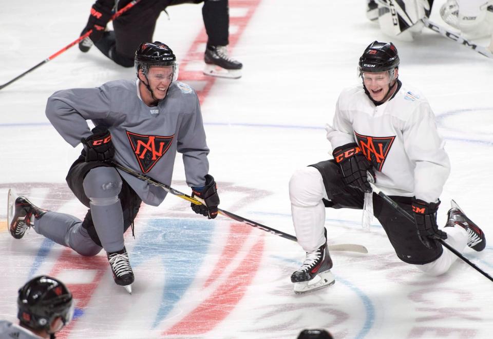 Canadians Connor McDavid, left, and Nathan MacKinnon, right, seen above with Team North America at the 2016 World Cup of Hockey, both said they'd love a shot to play at the 2026 Olympics.