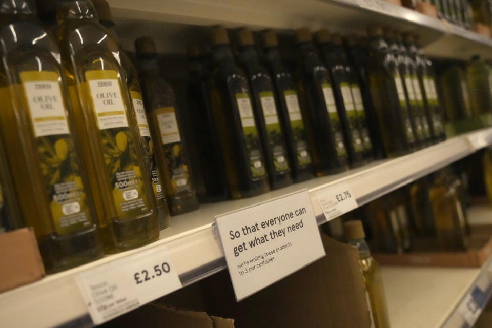 Various kinds of edible food oils on display along with a note to customers that they may only take 3 of theses items in a supermarket in London, Saturday, April 23, 2022. Global cooking oil prices have been rising since the COVID-19 pandemic began and Russia's war in Ukraine has sent costs spiralling. It is the latest fallout to the global food supply from the war, with Ukraine and Russia the world’s top exporters of sunflower oil. And it's another rising cost pinching households and businesses as inflation soars. (AP Photo/Alastair Grant)