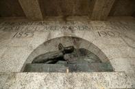 A damaged bust of Cecil John Rhodes, a controversial figure in the history of South Africa, is seen after the statue had been vandalised and had the head removed in Cape Town