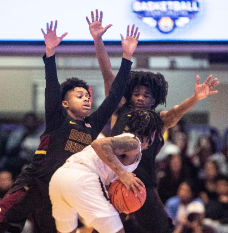 Kai Harvey and Tavien Tyler of Mount Vernon double team Lee Hester of New Rochelle during the section 1 Class AAA Boys Basketball Championship Game at The Westchester County Center in White Plains March 3, 2024. Mount Vernon defeated New Rochelle 41-37.