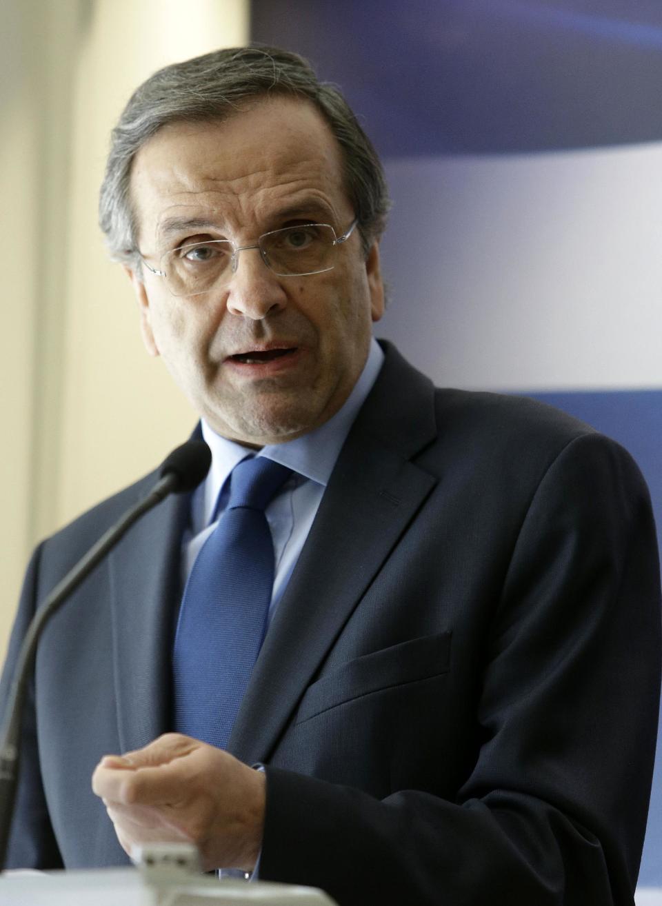 Greece's Prime Minister Antonis Samaras makes a statement to the media at the Finance Ministry in Athens, on Tuesday, March 18, 2014. Greece says it has reached an agreement with its international debt inspectors that will allow the release of a long-delayed rescue loan installment. Samaras said Tuesday that the agreement does not include the requirement for any new austerity measures. Finance Minister Yannis Stournaras said the text of the deal was being written up. (AP Photo/Thanassis Stavrakis)