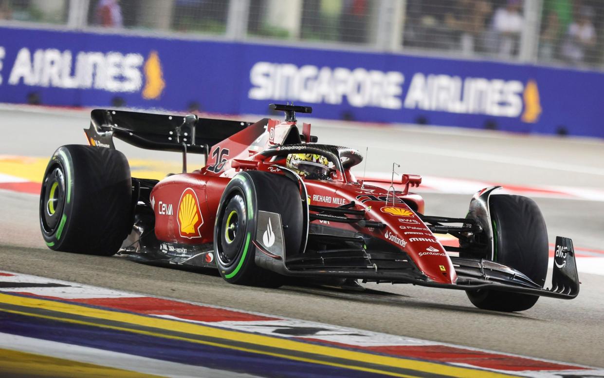 Ferrari driver Charles Leclerc of Monaco steers his car during the qualifying session at the Singapore Formula One Grand Prix, at the Marina Bay City Circuit in Singapore, Saturday, Oct. 1, 2022 - AP