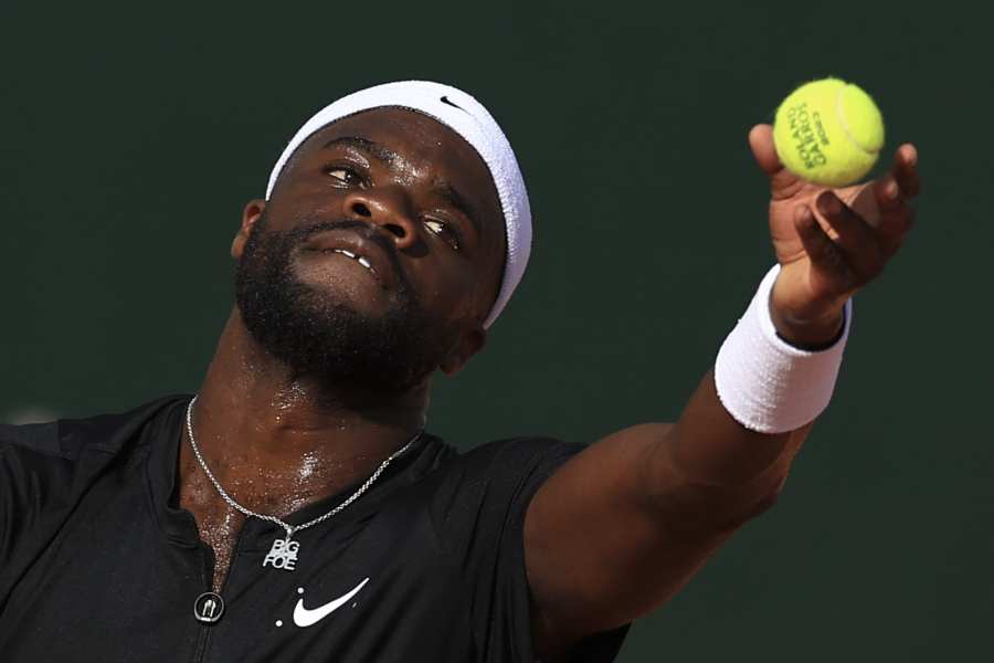 Frances Tiafoe (above) will face off against Ben Shelton in the U.S. Open quarterfinals. Here, Tiafoe serves against Serbia’s Filip Krajinovic on May 29 at the French Open in Paris. (Photo by Aurelien Morissard/AP)