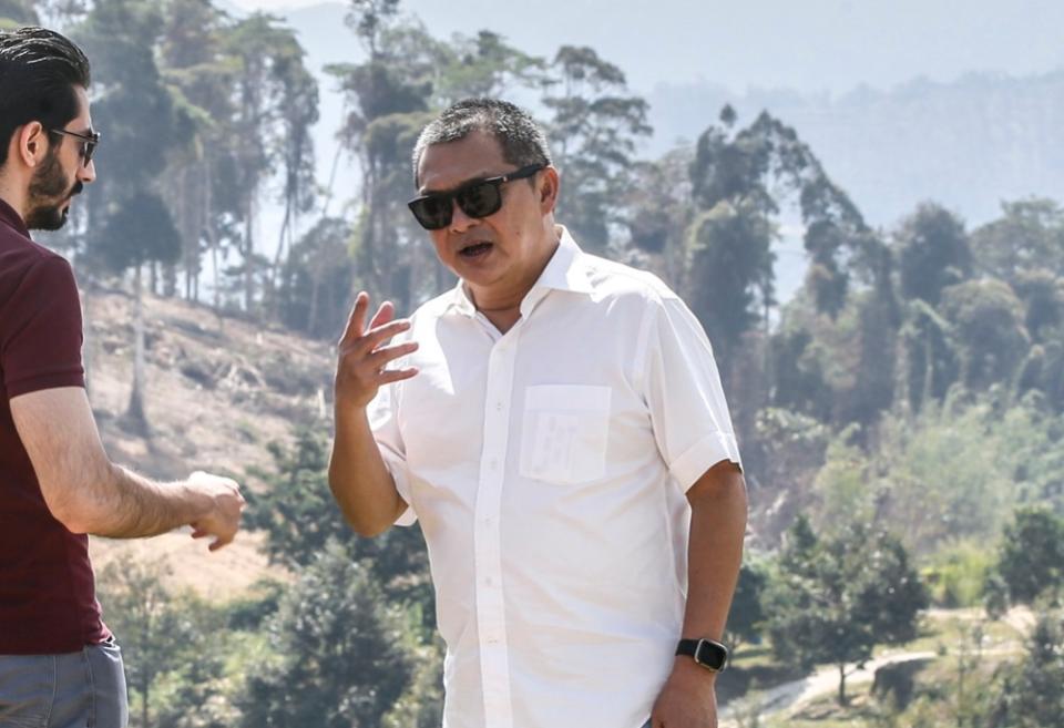 Royal Pahang Durian Group deputy chairman Datuk Albert Chang Si Fock takes the media on a tour inside the 1,000-acre durian farm in Raub. 