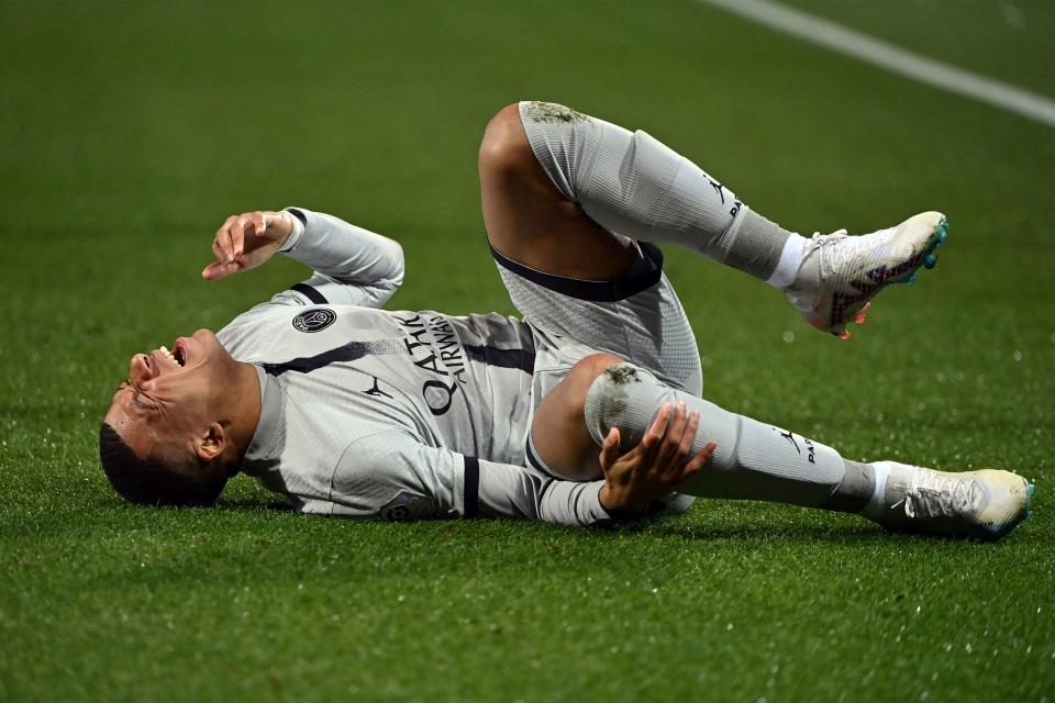 Paris Saint-Germain's French forward Kylian Mbappe lies on the ground after getting injured during the French L1 football match between Montpellier Herault SC and Paris Saint-Germain (PSG) at Stade de la Mosson in Montpellier, southern France on February 1, 2023. (Photo by Sylvain THOMAS / AFP) (Photo by SYLVAIN THOMAS/AFP via Getty Images)