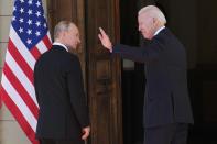 FILE - U.S President Joe Biden, right, and Russian President Vladimir Putin enter the 'Villa la Grange' during their meeting in Geneva, Switzerland in Geneva, Switzerland, Wednesday, June 16, 2021. In a video call last week, Biden warned Putin of "severe consequences" if Russia invades Ukraine, but promised to hold consultations to address Russian security concerns. (AP Photo/Alexander Zemlianichenko, Pool, File)