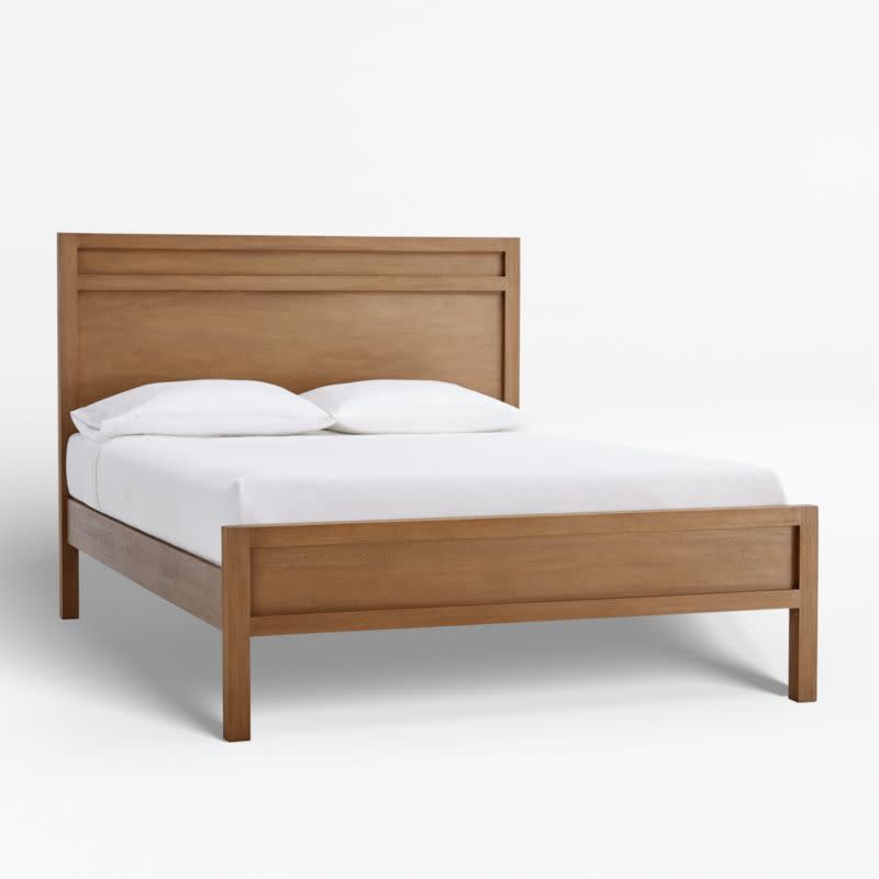 <p><strong>Crate & Barrel</strong></p><p>crateandbarrel.com</p><p><strong>$1599.00</strong></p><p>A solid wood bed frame is a classic furniture piece that works well with any room aesthetic. This bed frame from Crate & Barrel is loved by <a href="https://www.goodhousekeeping.com/author/1540/lexie-sachs/" rel="nofollow noopener" target="_blank" data-ylk="slk:Textiles Lab Executive Director Lexie Sachs;elm:context_link;itc:0;sec:content-canvas" class="link ">Textiles Lab Executive Director Lexie Sachs</a>, who <strong>raved about how much under-bed clearance (a whopping 13 inches) the bed frame offers</strong>, adding it "allows for me to put stuff underneath, with so many frames on the market being low to the ground." To coordinate with your space, choose among three colors of wood stain that reviewers said are "beautiful." Reviewers also spoke highly of the quality of the bed's mahogany, sharing that it's well made and sturdy. Because the popular frame is in such high demand, it may take several weeks and up to a couple of months to ship, depending on your location. <br></p>