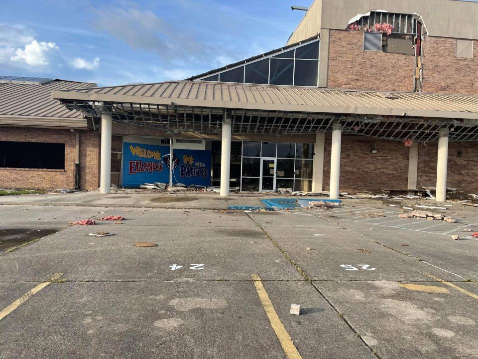 The front entrance of Ellender High School's basketball gym was damaged due to winds from Hurricane Ida in Houma.