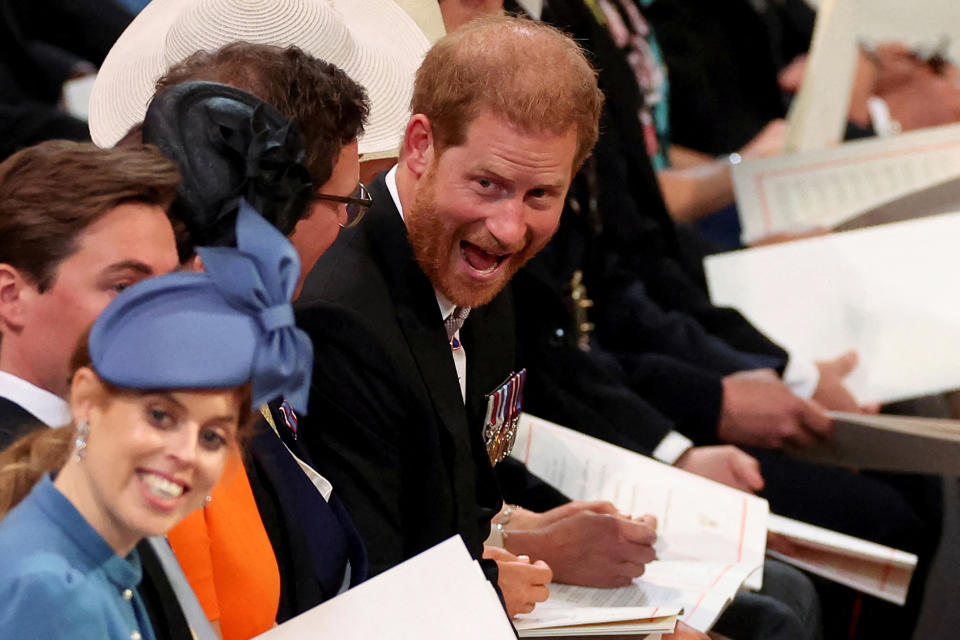 Britain's Prince Harry (C), Duke of Sussex, grimaces as he waits for the start of the National Service of Thanksgiving for The Queen's reign at Saint Paul's Cathedral in London on June 3, 2022 as part of Queen Elizabeth II's platinum jubilee celebrations. - Queen Elizabeth II kicked off the first of four days of celebrations marking her record-breaking 70 years on the throne, to cheering crowds of tens of thousands of people. But the 96-year-old sovereign's appearance at the Platinum Jubilee -- a milestone never previously reached by a British monarch -- took its toll, forcing her to pull out of a planned church service. (Photo by PHIL NOBLE / POOL / AFP) (Photo by PHIL NOBLE/POOL/AFP via Getty Images)