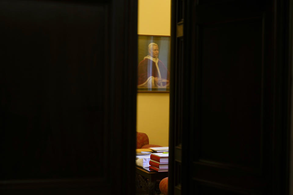 A studio of the Vatican court adorned with a portrait of Pope Pius X is seen through a partially opened door inside Palazzo della Cancelleria a renaissance building in the center of Rome that holds the Vatican supreme court, Tuesday, Sept. 12, 2023. The Vatican on Tuesday opened the doors to one of Renaissance Rome’s most spectacular palazzos that is normally hidden from public view since it houses some of the Holy See’s most secretive offices: the ecclesial tribunals that decide everything from marriage annulments to plenary indulgences. (AP Photo/Gregorio Borgia)