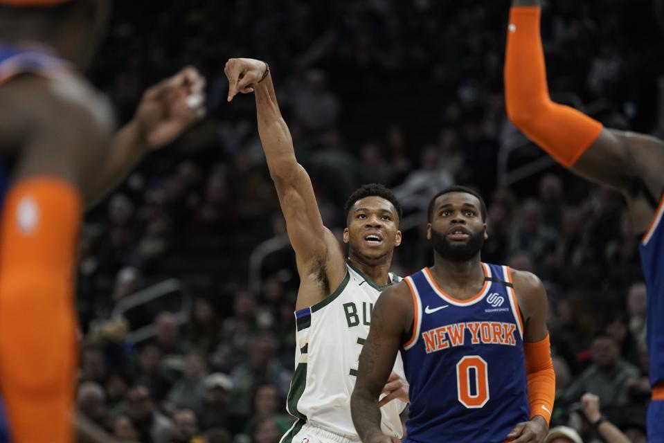 Milwaukee Bucks' Giannis Antetokounmpo shoots a three-point basket during the second half of an NBA basketball game against the New York Knicks Tuesday, Jan. 14, 2020, in Milwaukee. (AP Photo/Morry Gash)