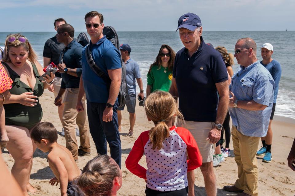 President Joe Biden talks to people as he walks on the beach with his granddaughter Natalie Biden and his daughter Ashley Biden, Monday, June 20, 2022 at Rehoboth Beach, Del. (AP)