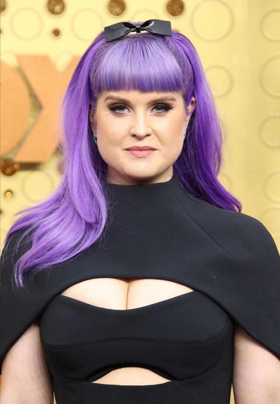 Kelly Osbourne poses for a photo