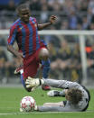 FILE - In this Wednesday, May 17, 2006 file photo Barcelona forward Samuel Eto'o is fouled by Arsenal goalkeeper Jens Lehmann during their Champions League final soccer match in the Stade de France in Saint-Denis, outside Paris. F is for Foul. Lehmann was given a red card for this foul and despite leading for a long period of the match his absence cost the Arsenal side dearly as they went on to lose 2-1 to Barcelona. (AP Photo/Bernat Armangue, File)
