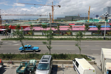 Cranes are seen in Horgos, China May 19 2017. Picture taken May 19, 2017. REUTERS/Sue-Lin Wong