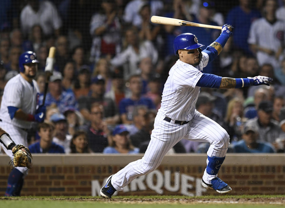 Chicago Cubs' Javier Baez watches his RBI single during the sixth inning of the team's baseball game against the San Francisco Giants on Wednesday, Aug 21, 2019, in Chicago. (AP Photo/Paul Beaty)