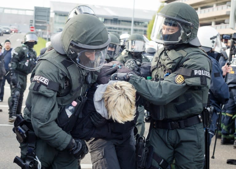 Hundreds of anti-fascist demonstrators rallied outside Alternative fur Deutschland's convention centre on April 30, 2016 as police took some 400 activists into custody