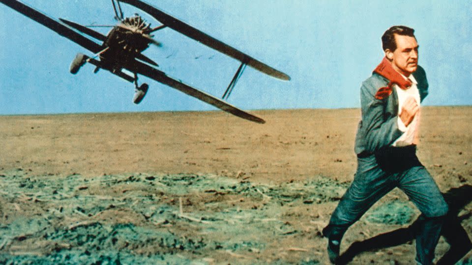 Cary Grant running from a biplane under attack in an iconic scene issued as a publicity still for the film, "North by Northwest." - Silver Screen Collection/Moviepix/Getty Images