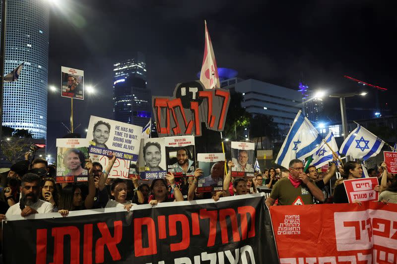 People attend a protest calling for the immediate release of hostages, in Tel Aviv