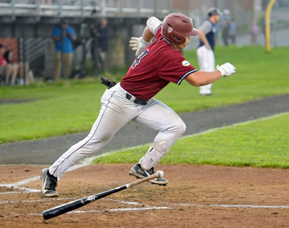 Tommy Troy of Wareham launches a hit off a Brewster pitch to bring in two runs in the third inning.