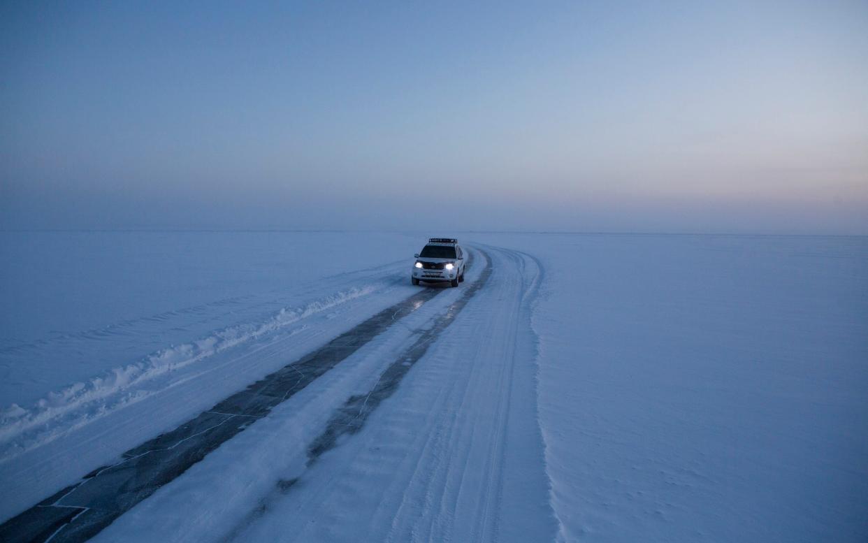 An illegal winter road on the ice of the Lena river - Maria Turchenkova 