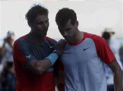 Rafael Nadal of Spain (L) shakes hands with Grigor Dimitrov of Bulgaria after their men's singles quarter-final tennis match at the Australian Open 2014 tennis tournament in Melbourne January 22, 2014. REUTERS/Bobby Yip