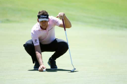 Ian Poulter of England lines up a putt on the 18th green during the first round of the 2018 US Open, at Shinnecock Hills Golf Club in Southampton, New York, on June 14