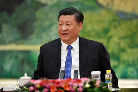 FILE PHOTO: Chinese President Xi Jinping meets World Economic Forum (WEF) Executive Chairman Klaus Schwab (not pictured) at the Great Hall of the People in Beijing, China April 16, 2018. Naohiko Hatta/Pool via REUTERS